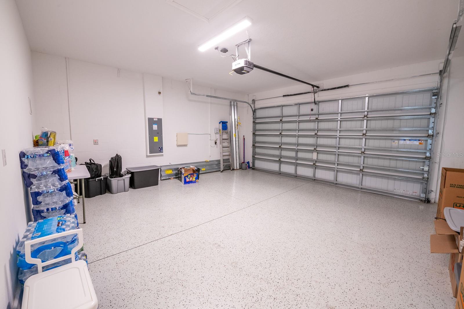 Large 2 car garage w/ epoxy flooring.