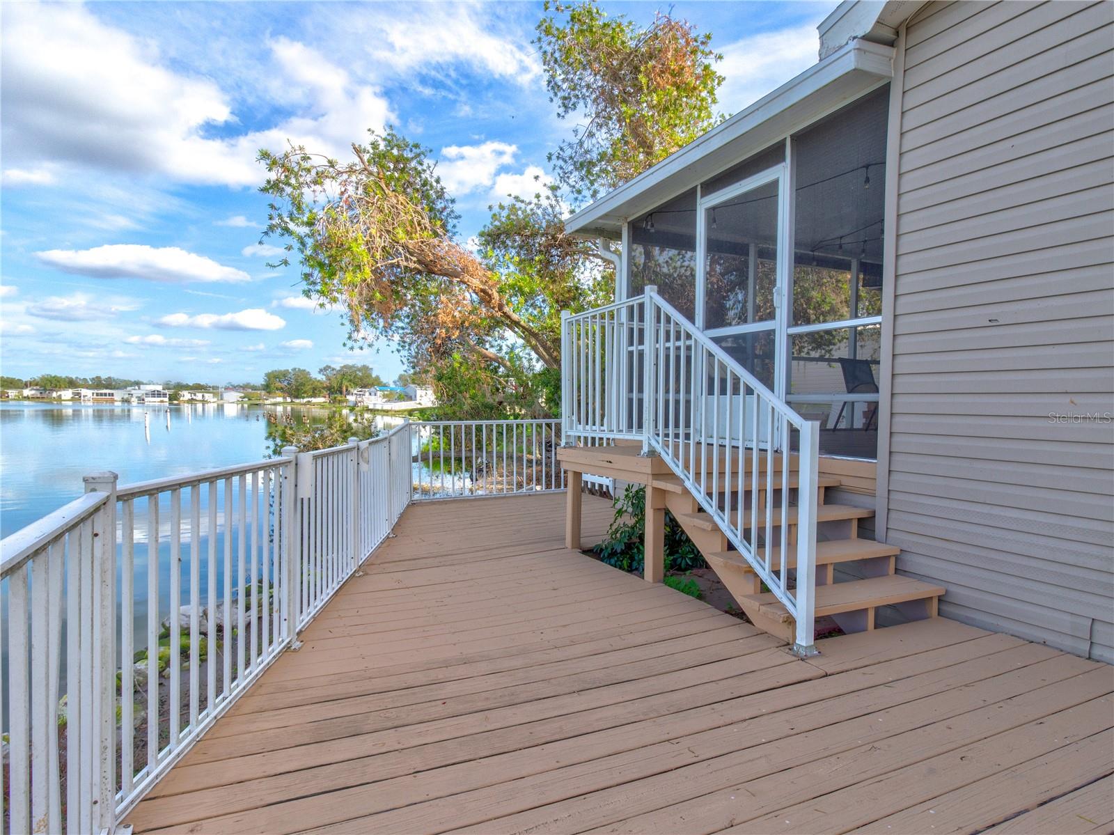 Back Deck and steps up to screened in enclosed Lanai