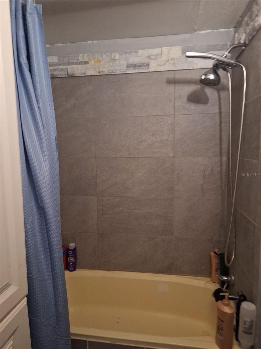 NEW WALL TILE IN TUB, SINK, TOILET AND FLOORING