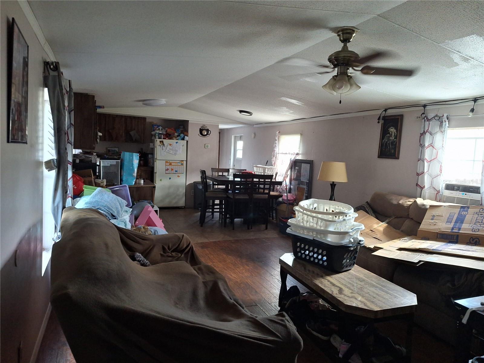 A LOOK THROUGH LIVING ROOM TO KITCHEN FROM FRONT DOOR