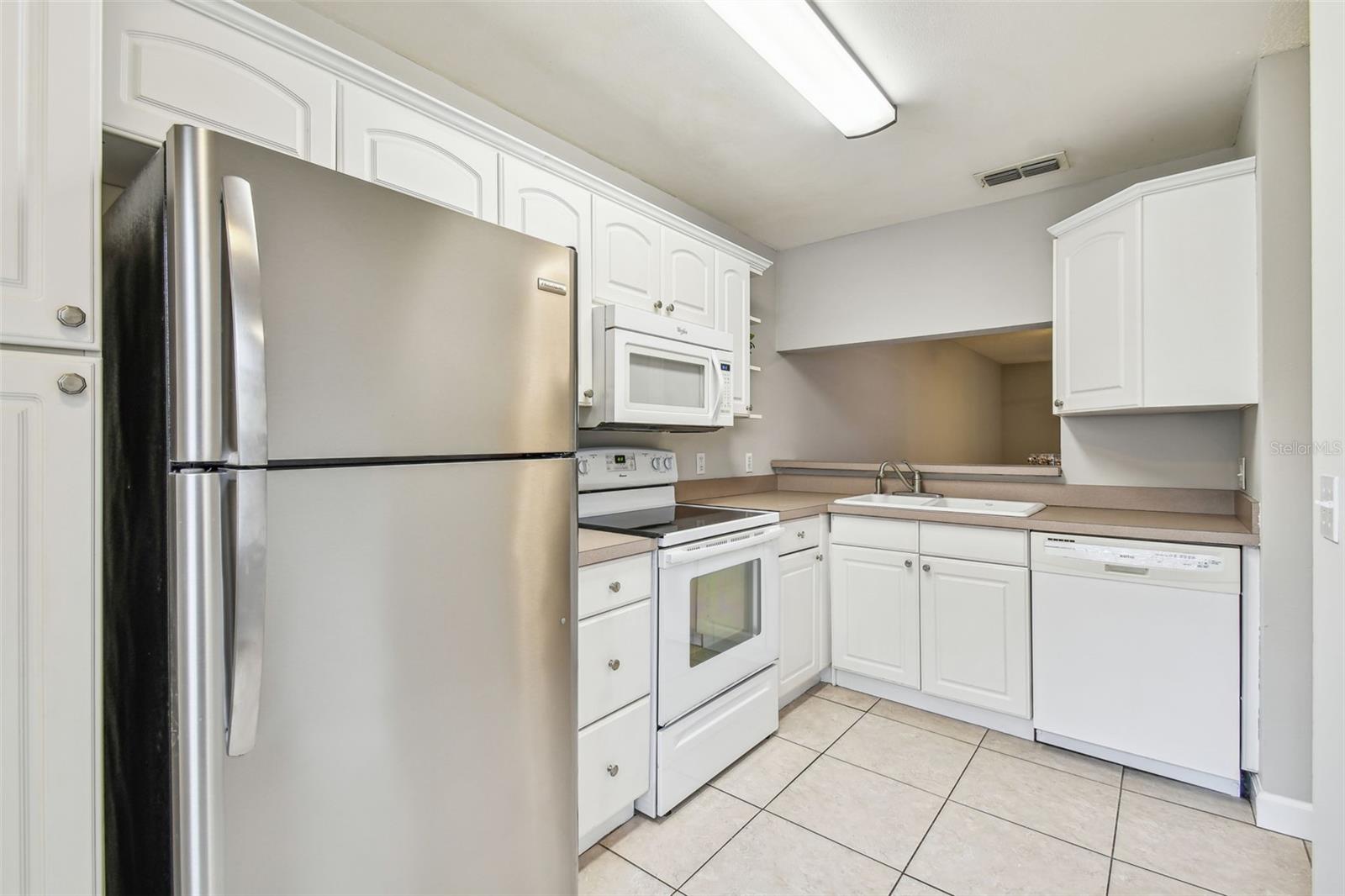 Kitchen includes all appliances....smooth top range, microwave, dishwasher and refrigerator.