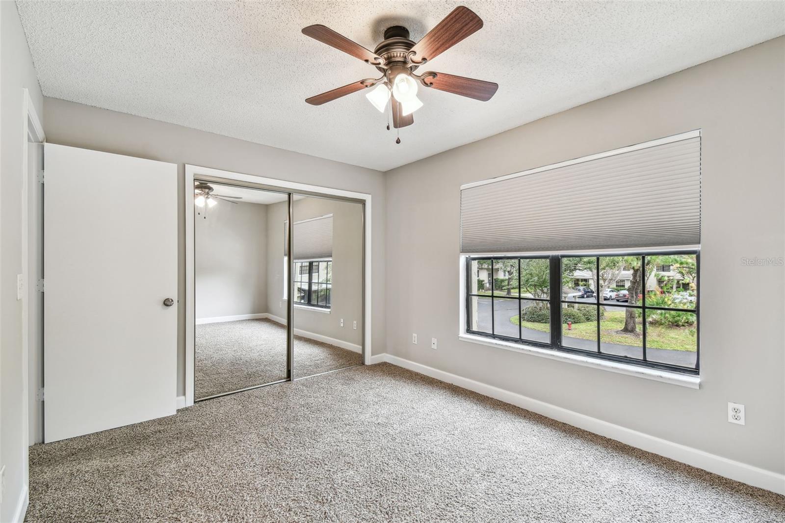 Bedroom 2 has a large window bringing in natural light and a good sized closet.