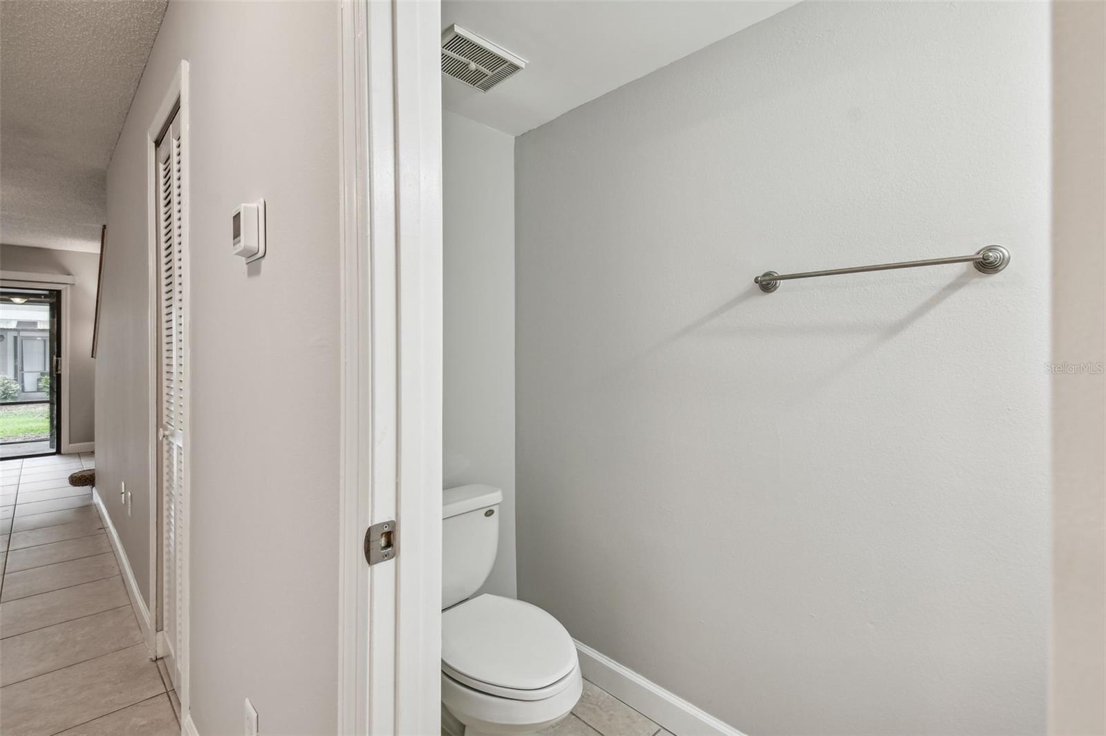 Half bath is located off the front foyer.