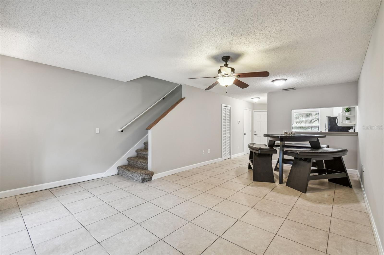 Stairs to the second floor are at the rear of the home.