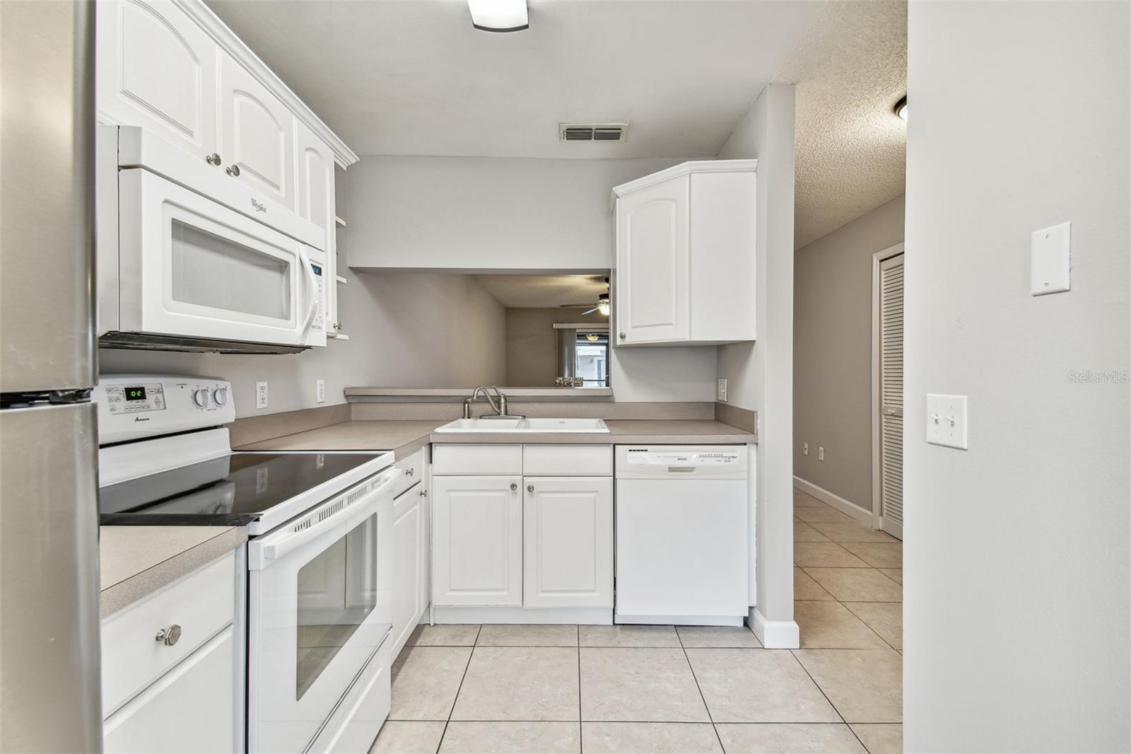 The kitchen is located at the front of the home. It opens to the greatroom.