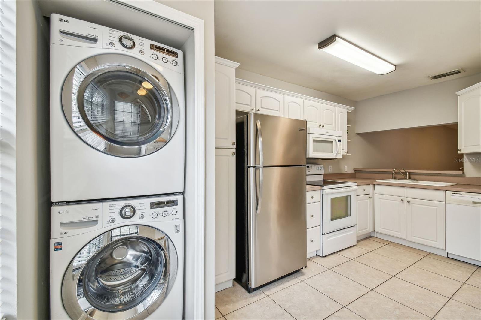 The laundry closet is located in the kitchen area. Front load Washer and dryer are included!