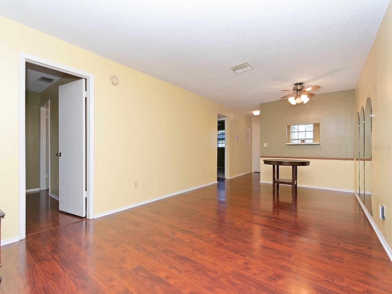 The guest bedroom and bathroom are in a short hallway off the living room