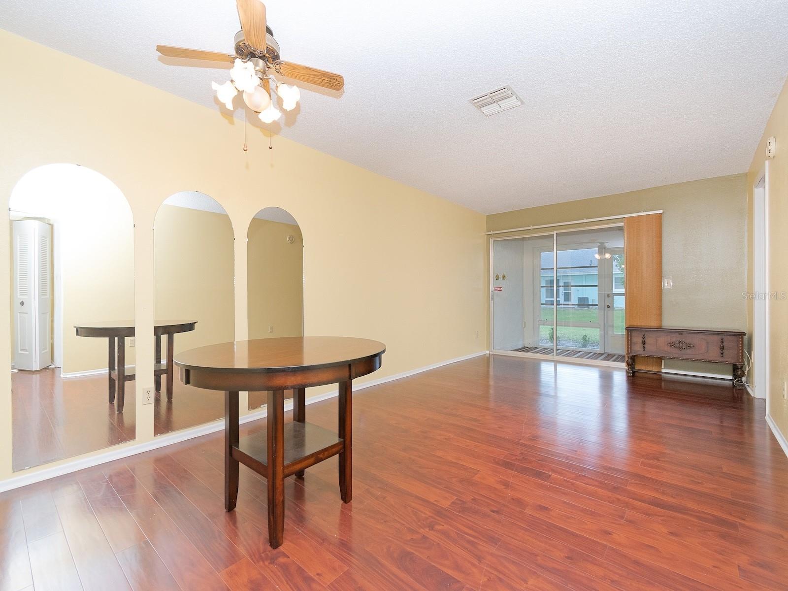 There is room for a dining room table just outside the kitchen