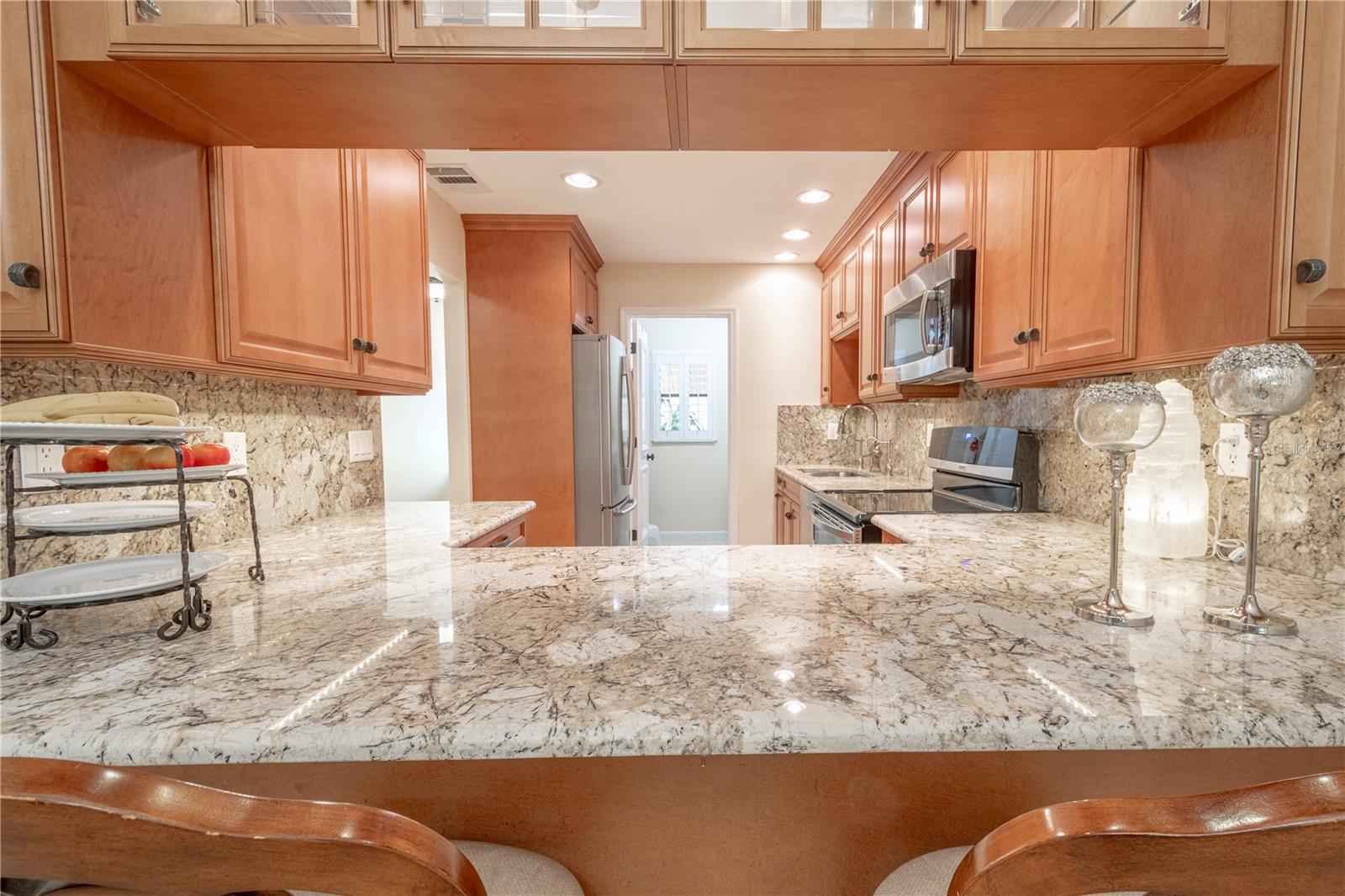 The kitchen has a breakfast bar with seating for four.