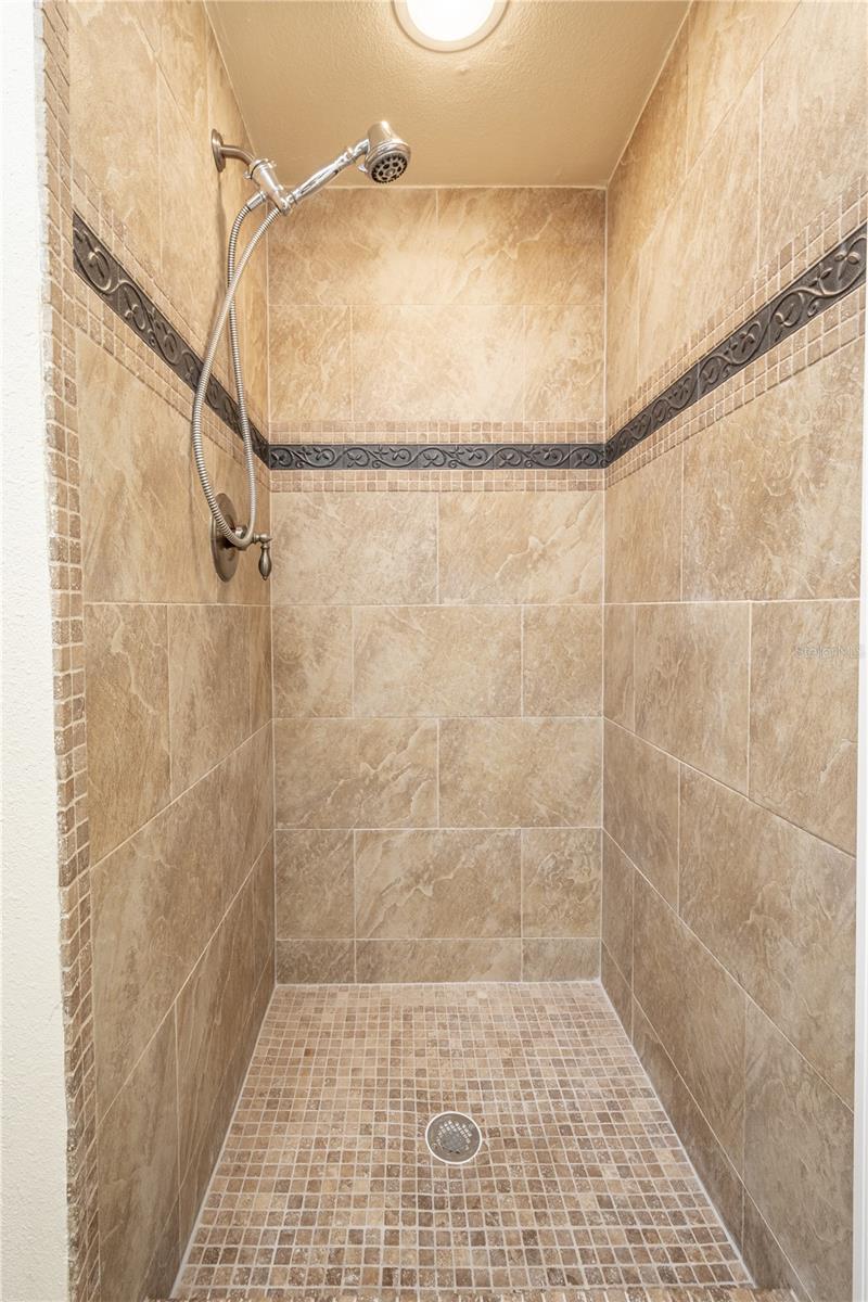 The primary ensuite features a spacious walk-in shower.