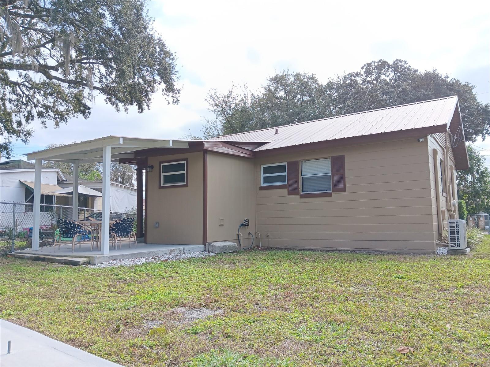 Concrete back deck with metal roof