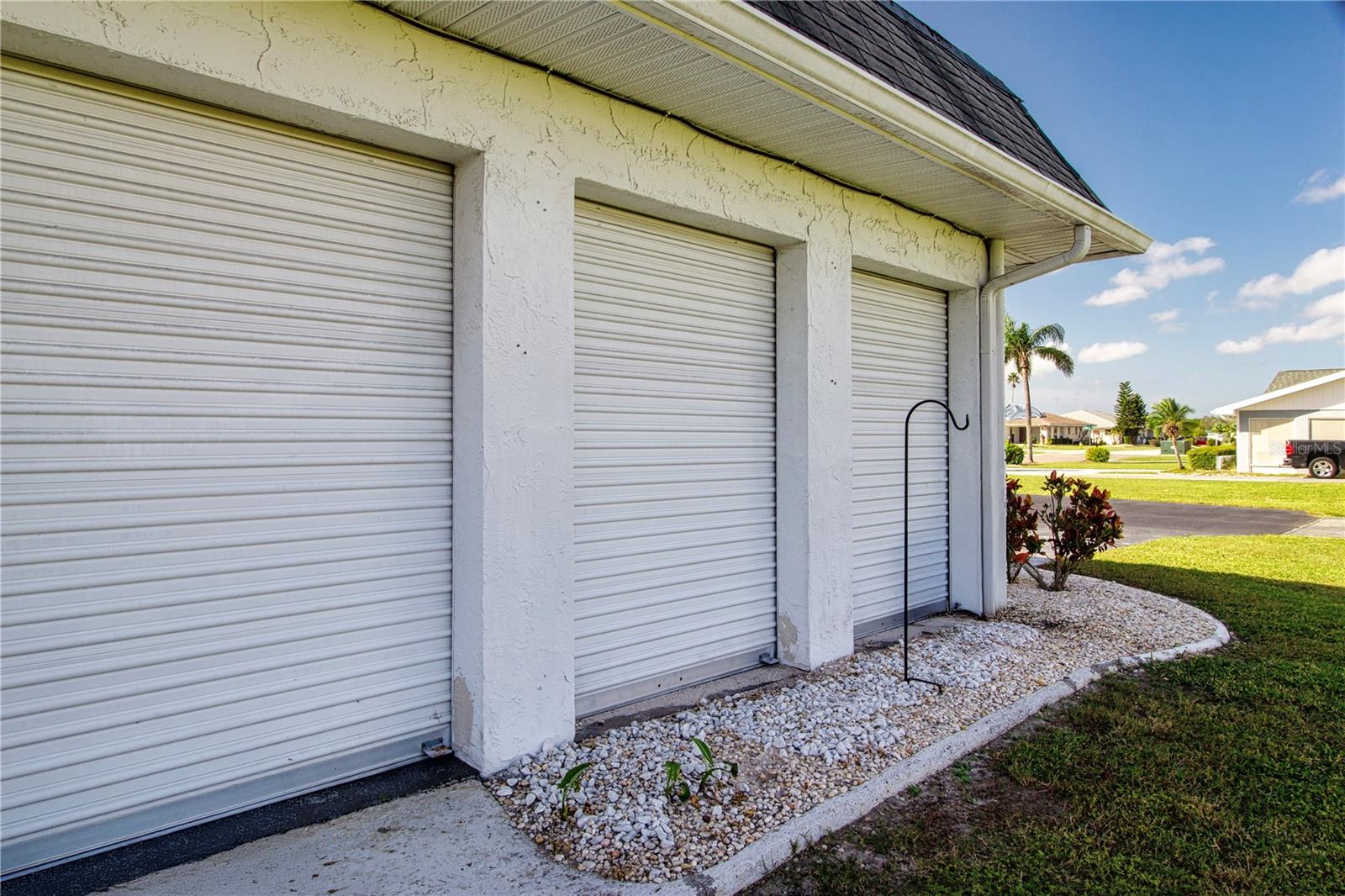 Unique roll up doors on garage side