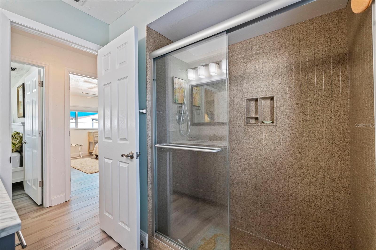 Bathroom 2 with shower and door to pool