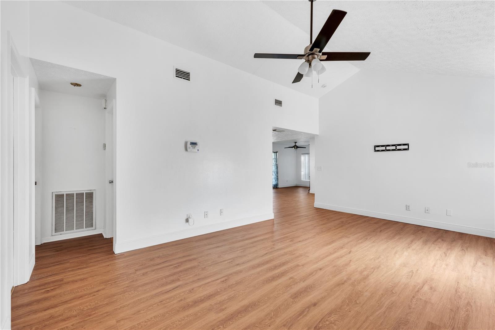 19x13 living room with cathedral ceiling greets you as you enter the front door.