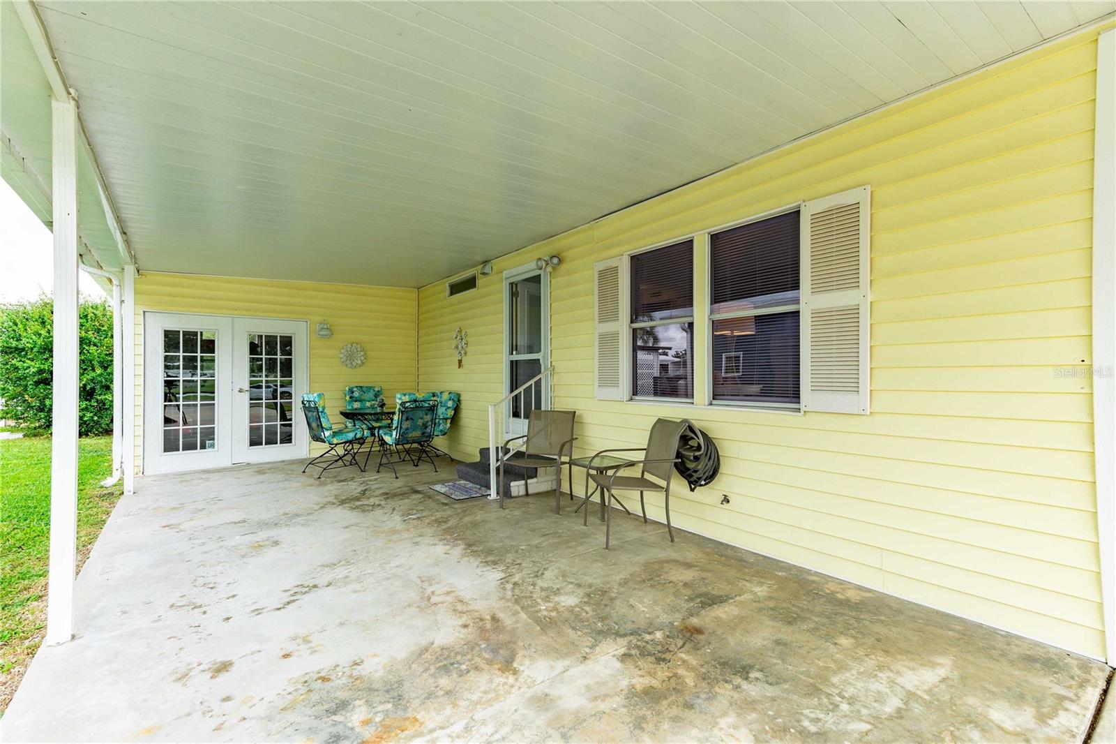 French doors lead to laundry and storage