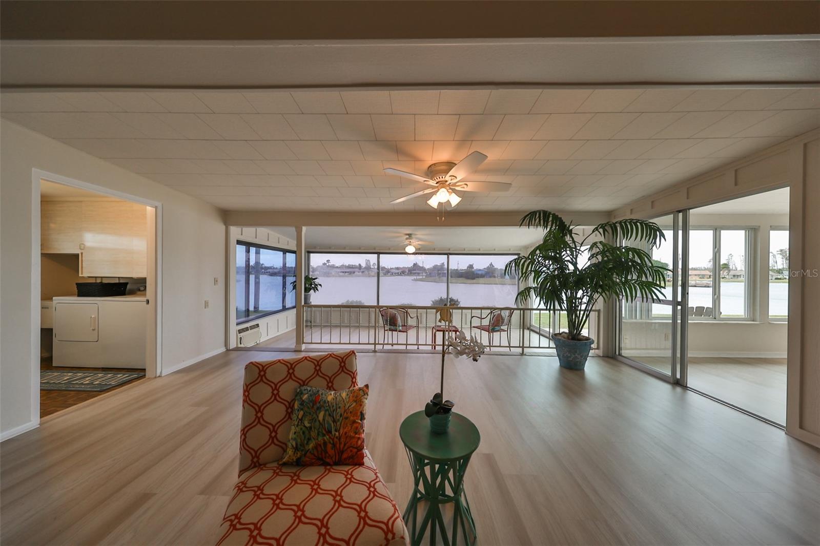 Open Living Room/ Dining Room Combo Covered Lanai, New LVT Flooring