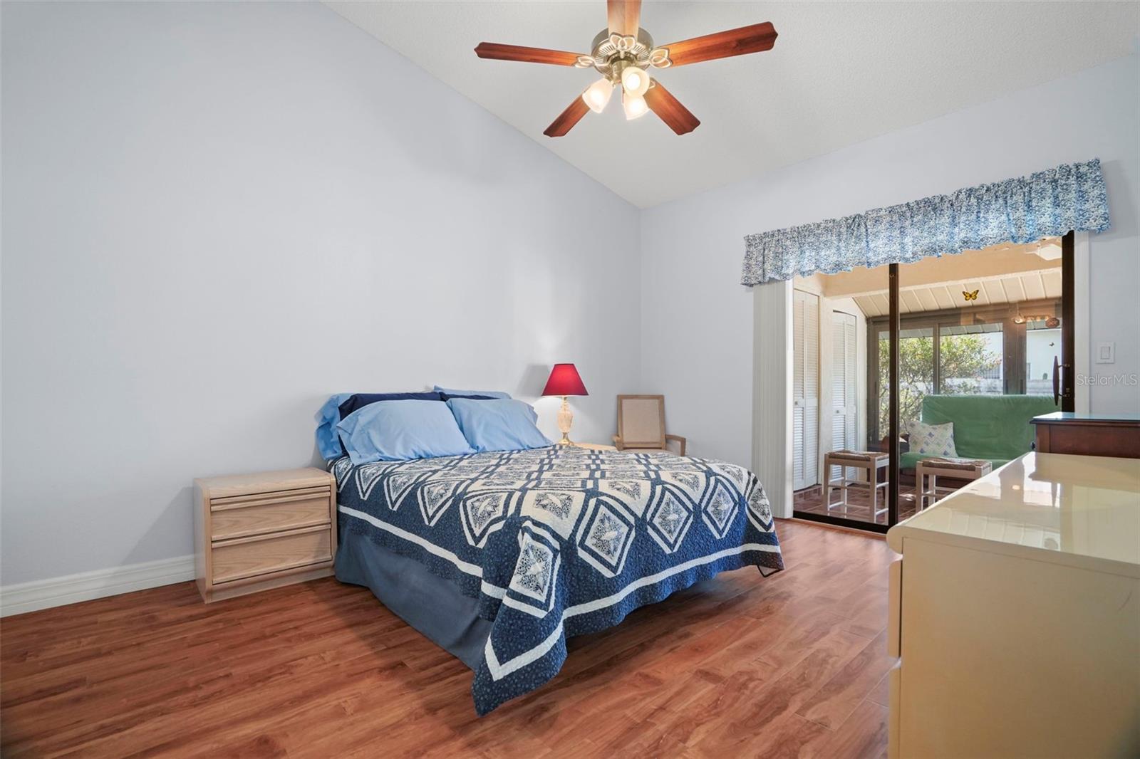 Spacious primary suite leading to the screened lanai.