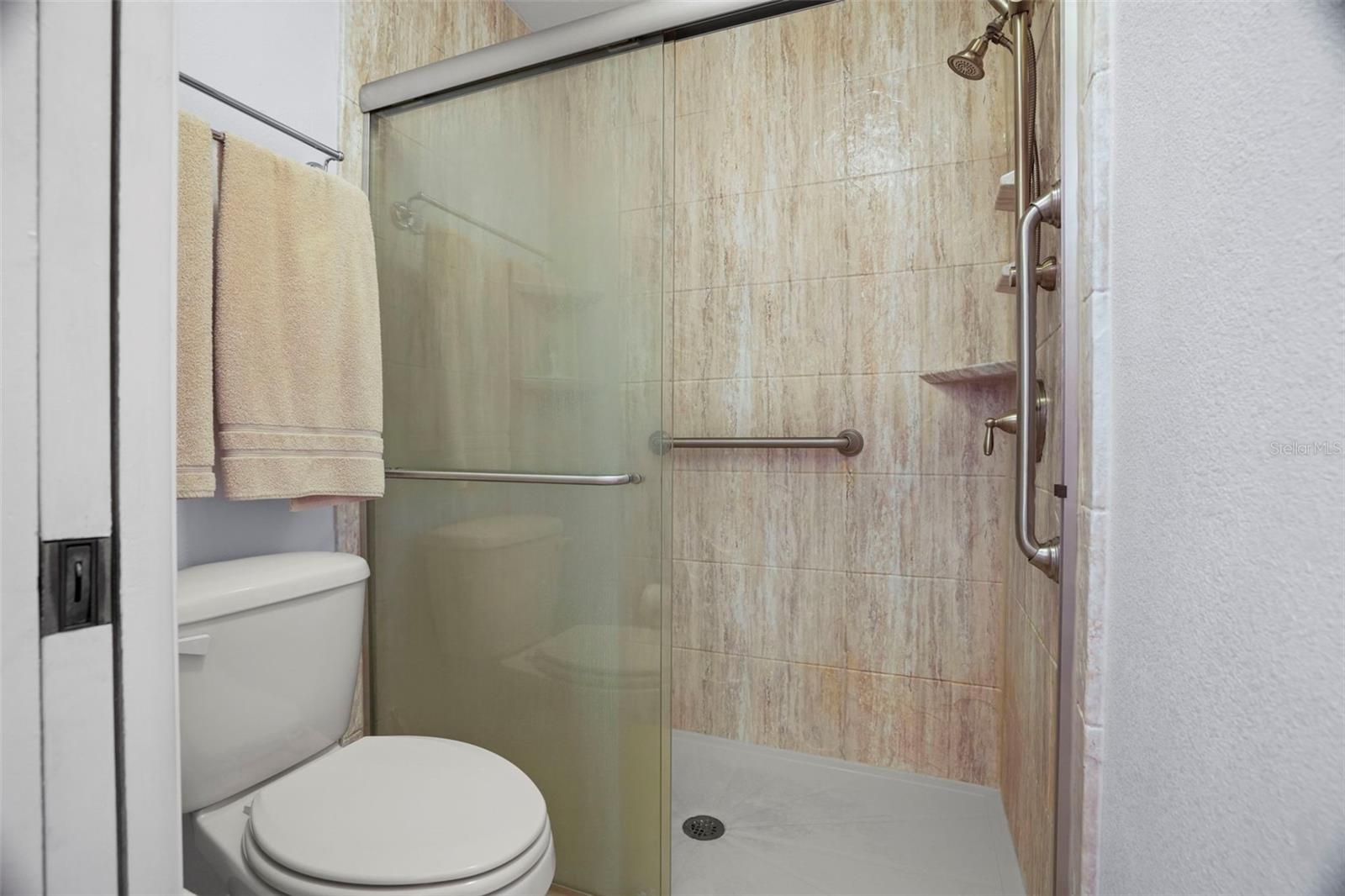 Walk-in shower in primary bath.