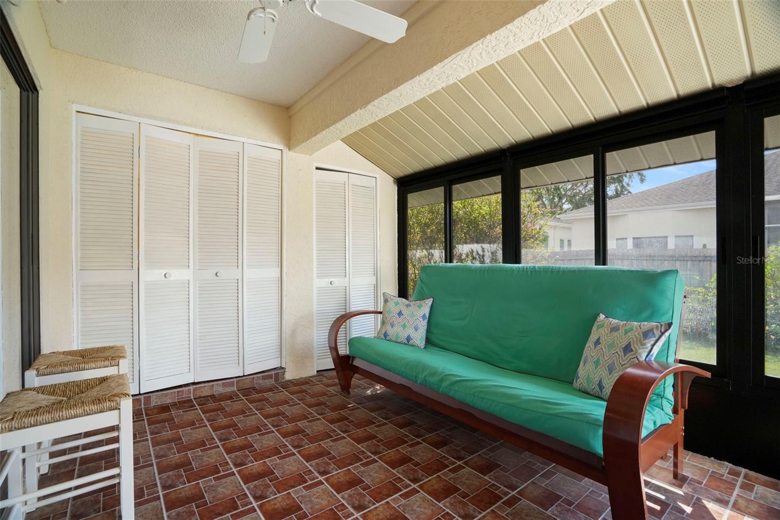 Screened in lanai with storage and closet for waher/dryer.