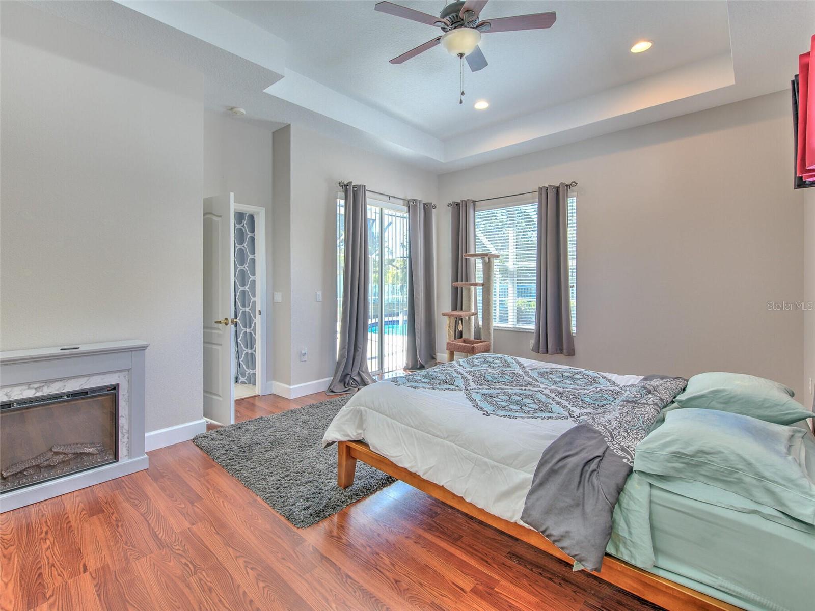 Primary bedroom with slider to the lanai