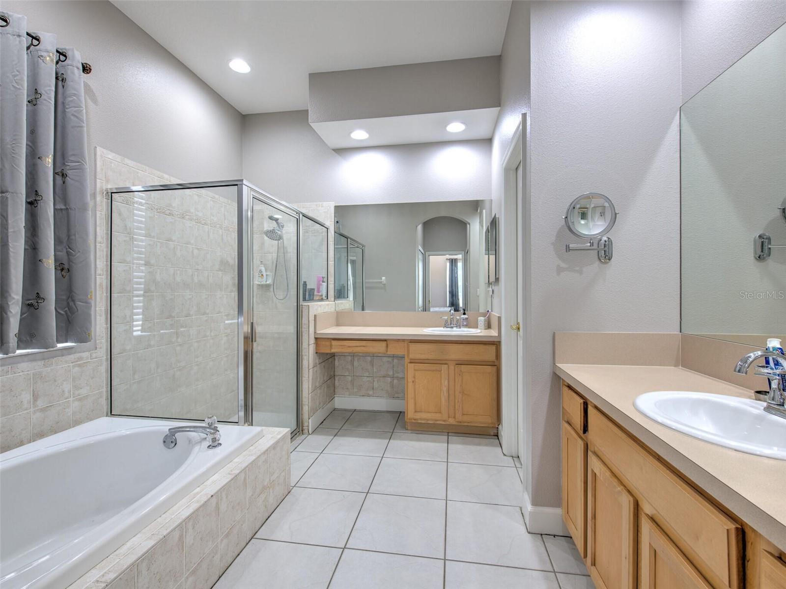 Primary bathroom, dual split vanity, step-in shower and separate bathtub; private water closet