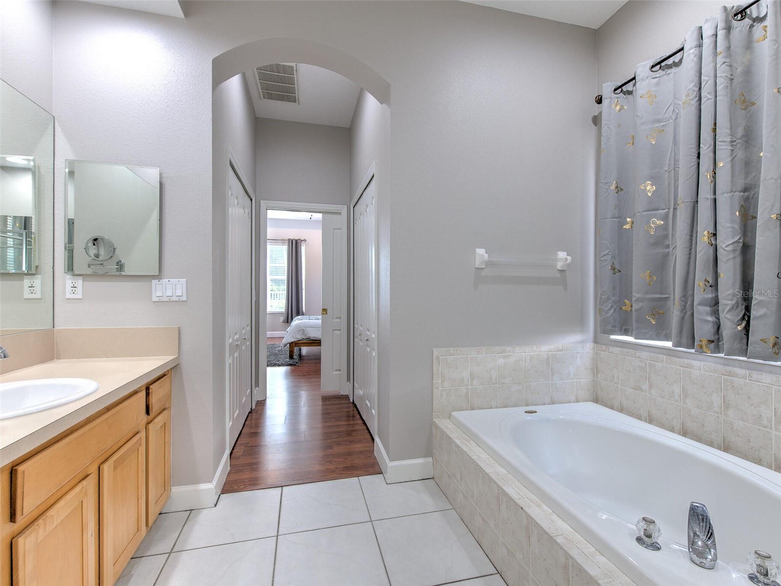 Primary bathroom looking back toward bedroom