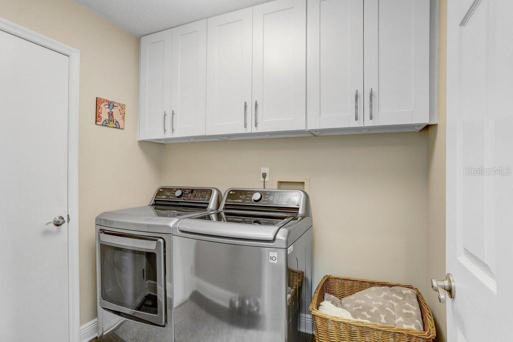 Laundry Room has overhead cabinets.