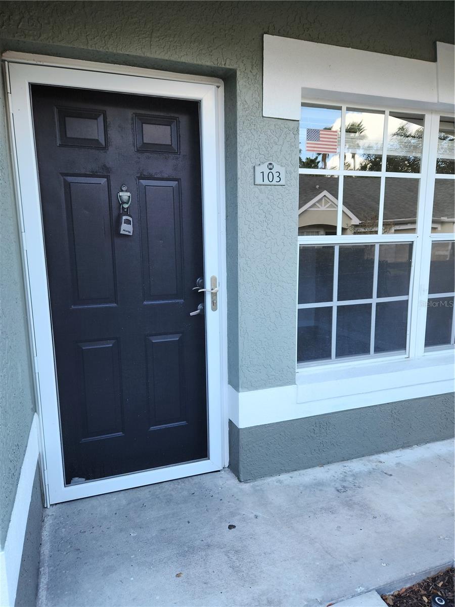 Front door has screen door w glass panel insert in garage