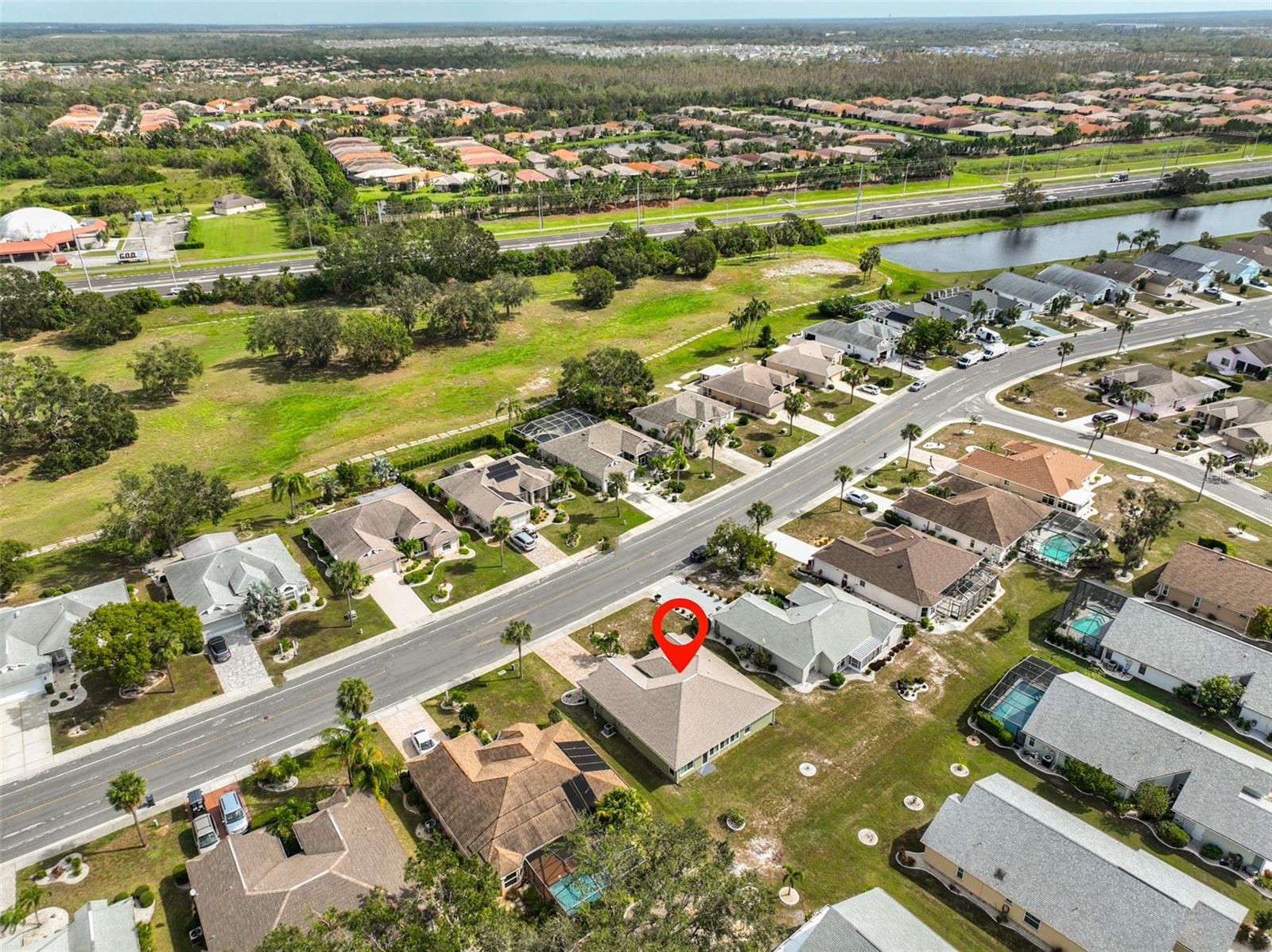 Aerial view of back of home & backyard