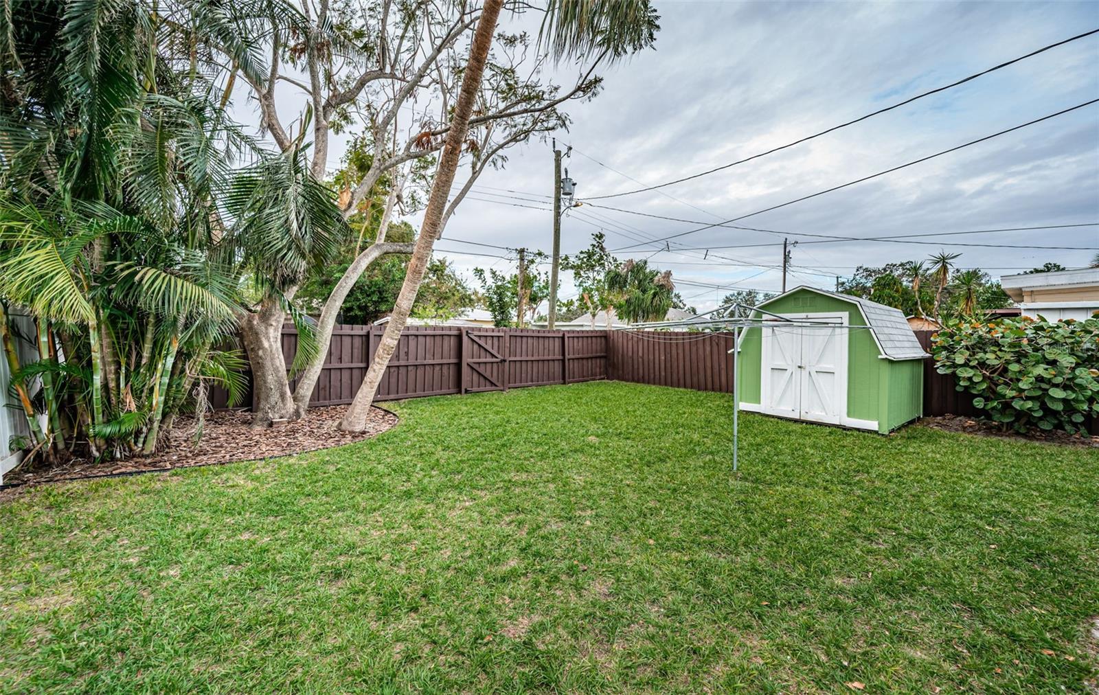 So much space for playing, entertaining, gardening, and furry friends.  There is also alley access through the gate.