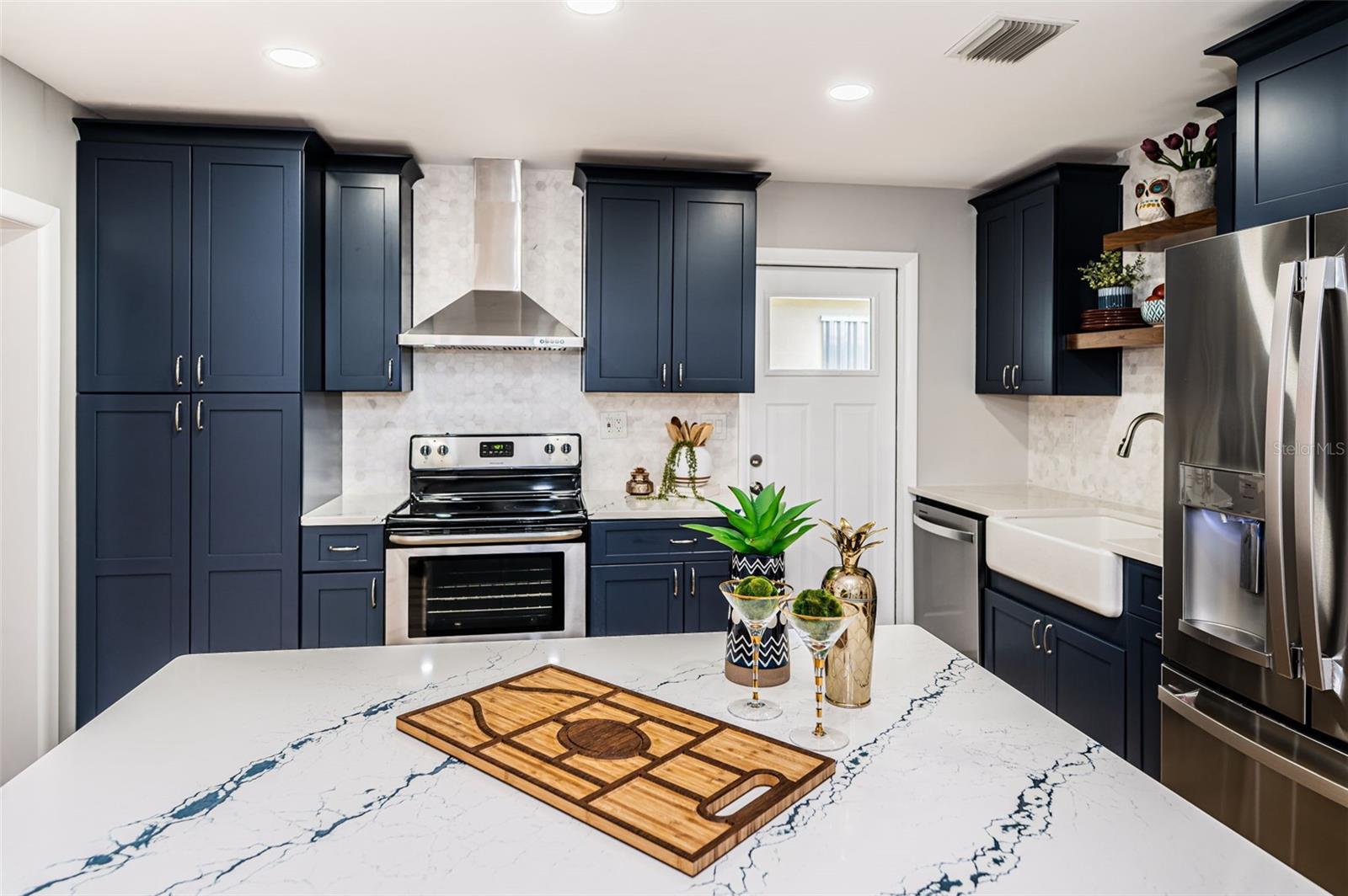 The large pantry with slide out drawers will provide you tons of space.