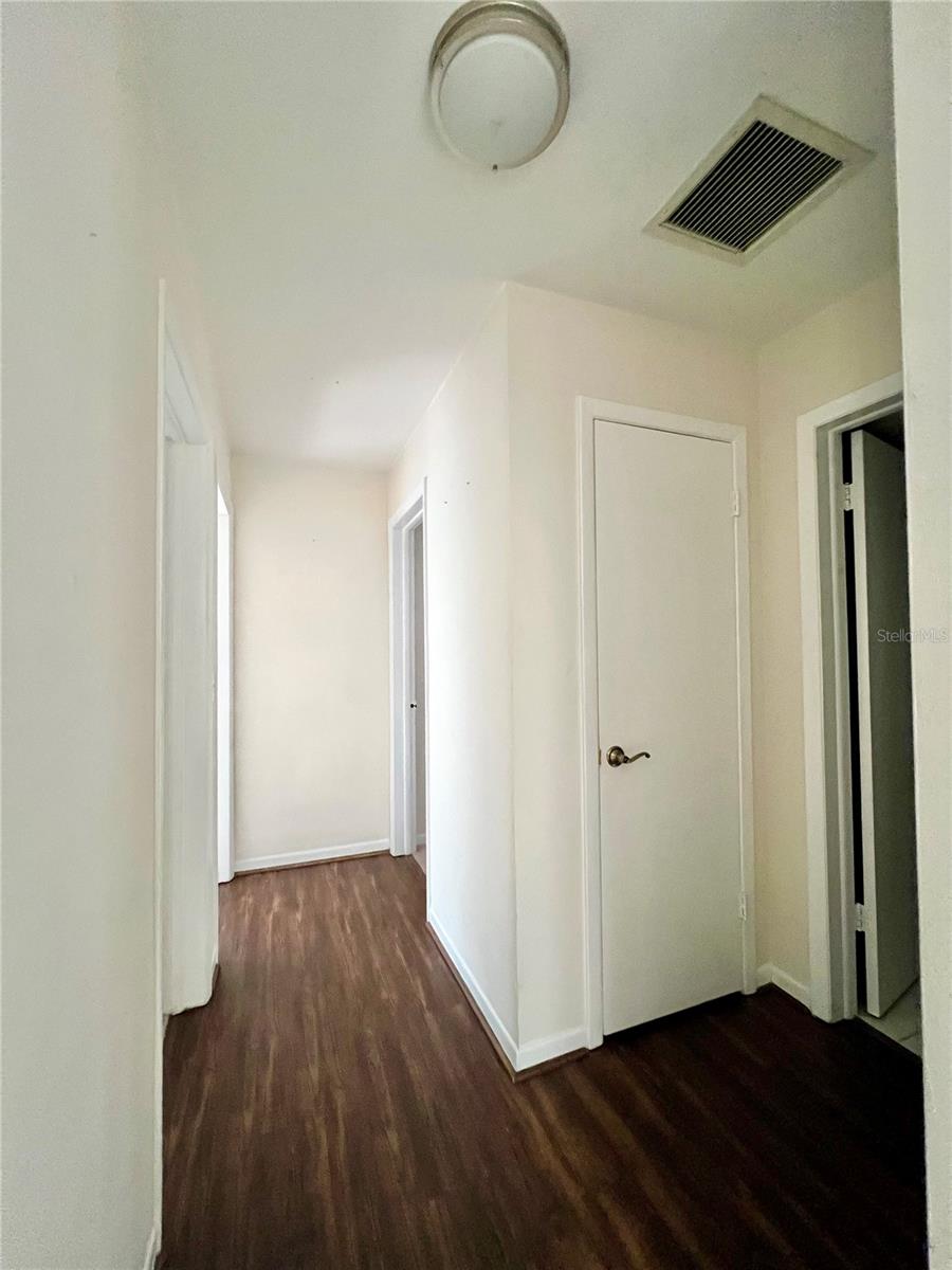 hallway to 3 bedroom and bath