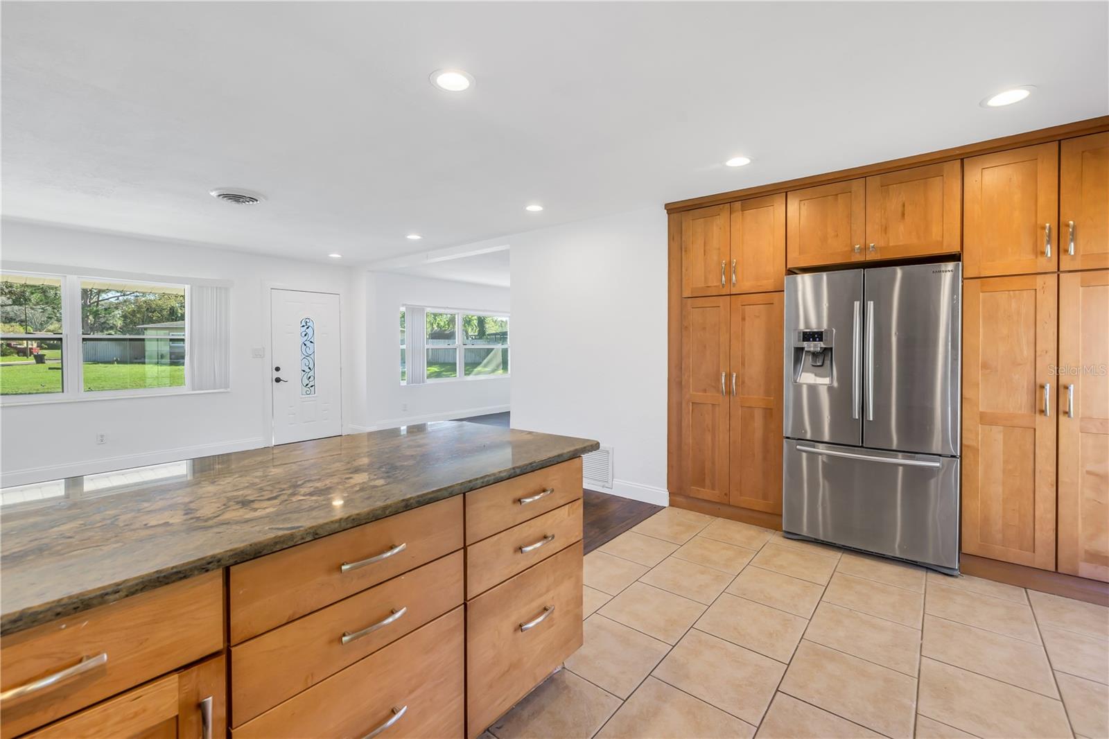 Kitchen boasts granite counter tops and stainless steel appliances.