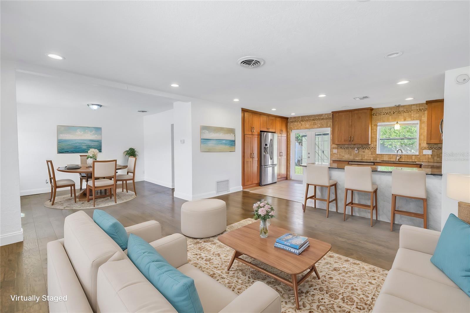 Virtually staged living and dining room.