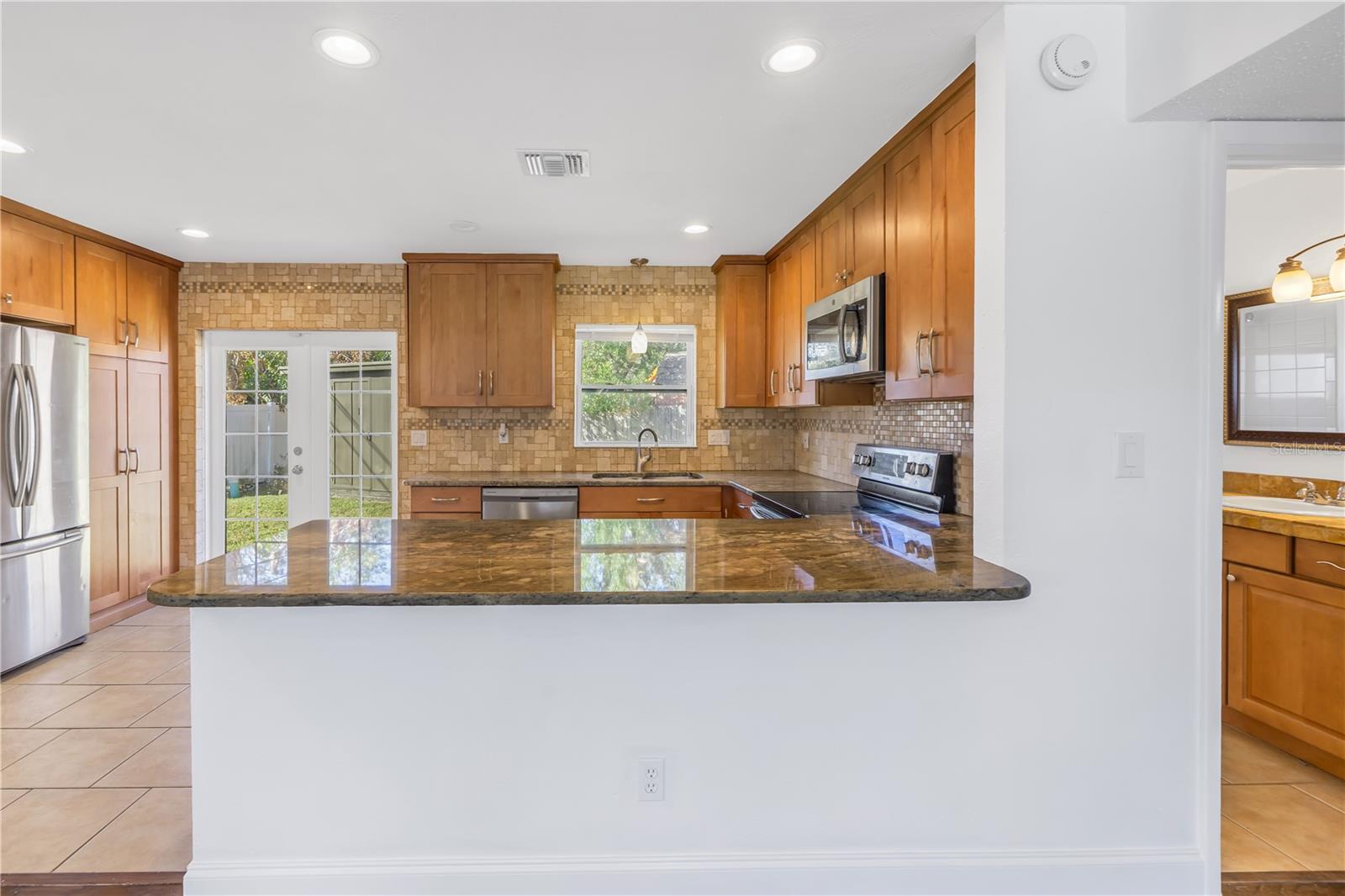 Kitchen offers a breakfast bar.