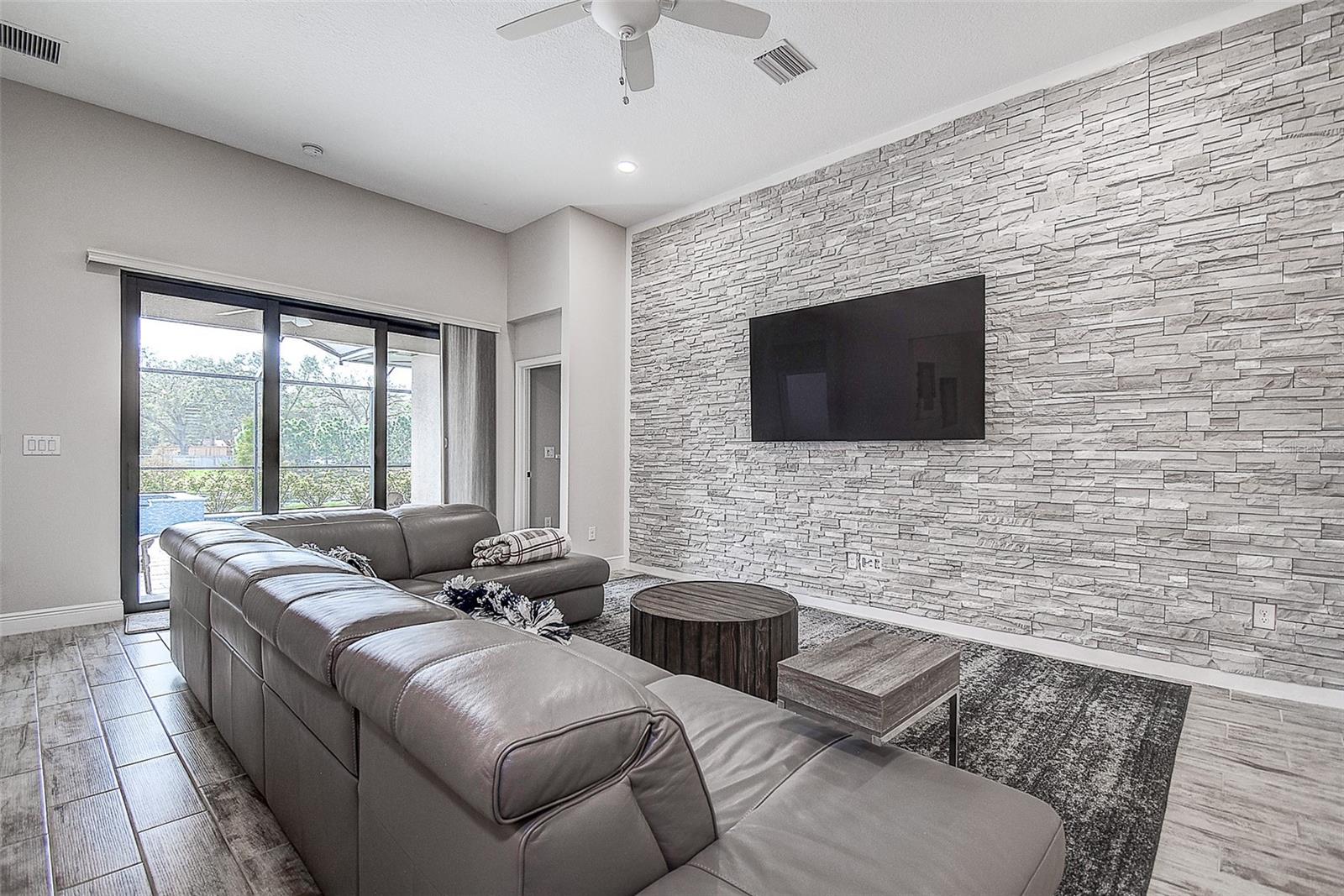 Living area with stone wall feature