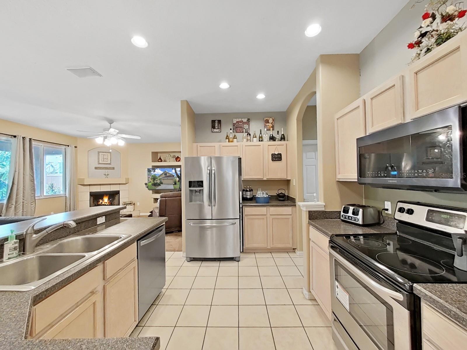 Open plan kitchen with stainless steel appliances