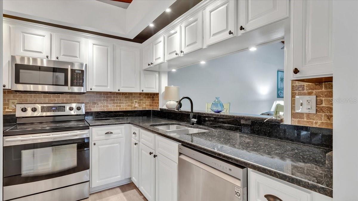 Stainless steel appliances and new dishwasher.