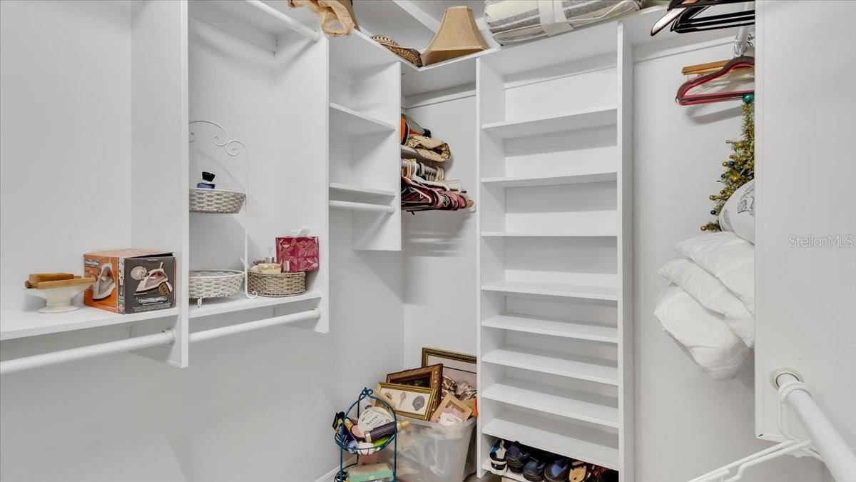 Walk-in closet in master bedroom.