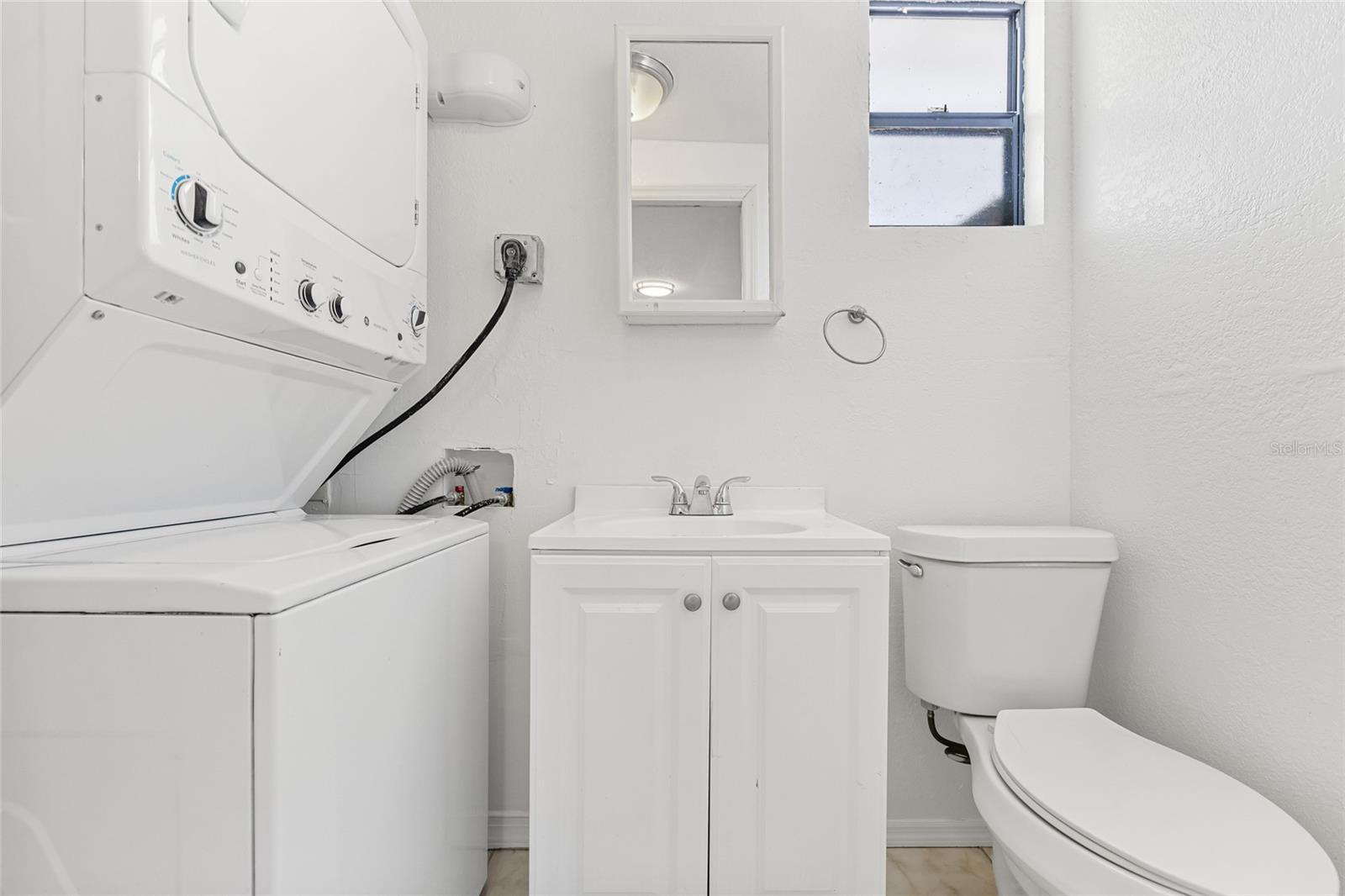 Half Bath with stackable washer and dryer