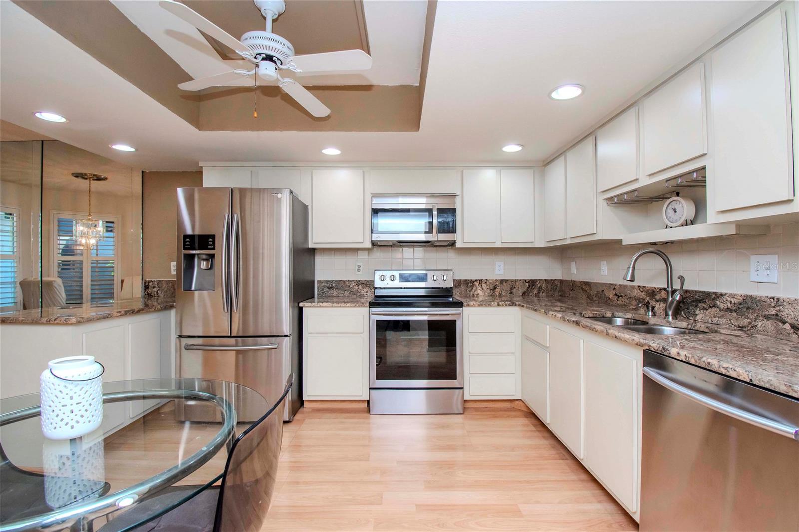 Full view of the kitchen.  Family choose to add an 2nd small table in the corner area. New owner could add a coffee station, bar area or rearrange the kitchen layout.