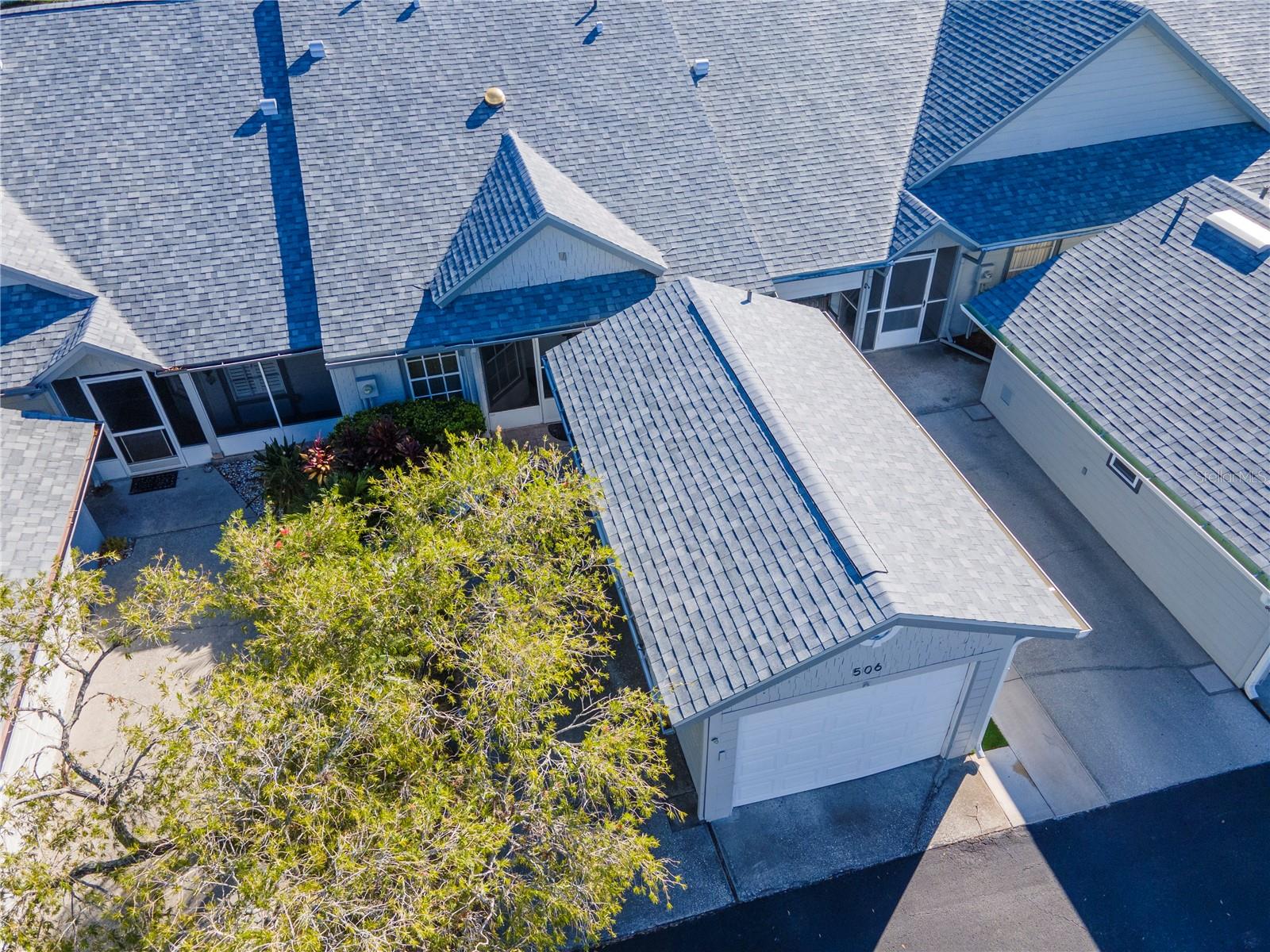 Aerial view of villa and garage.