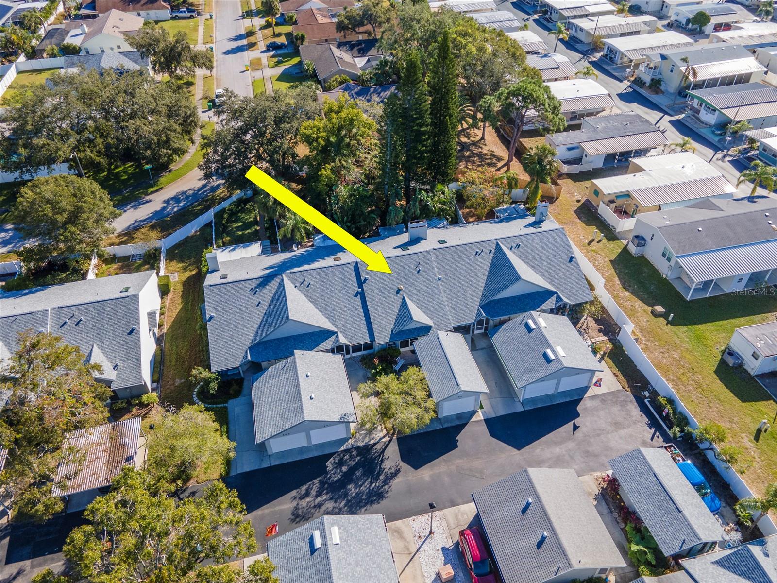 Aerial view of villa and garage.  Please notice garage is not attached or shared with neighbor.