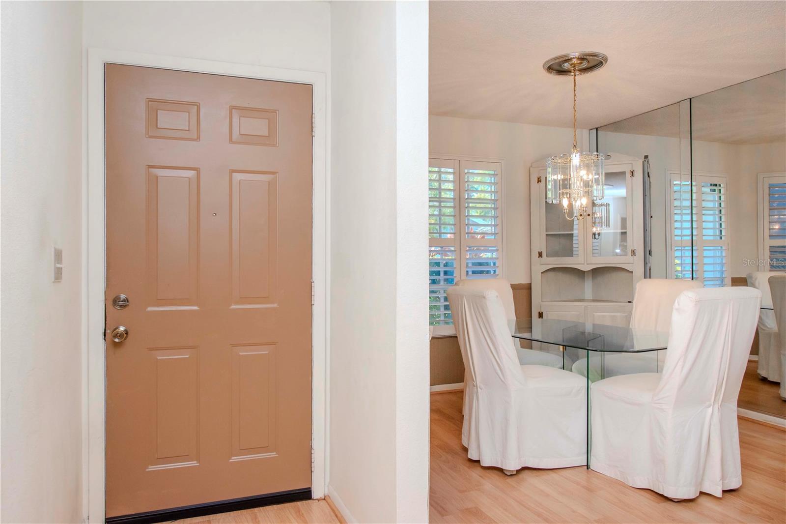 inside view of the front door and dining area.