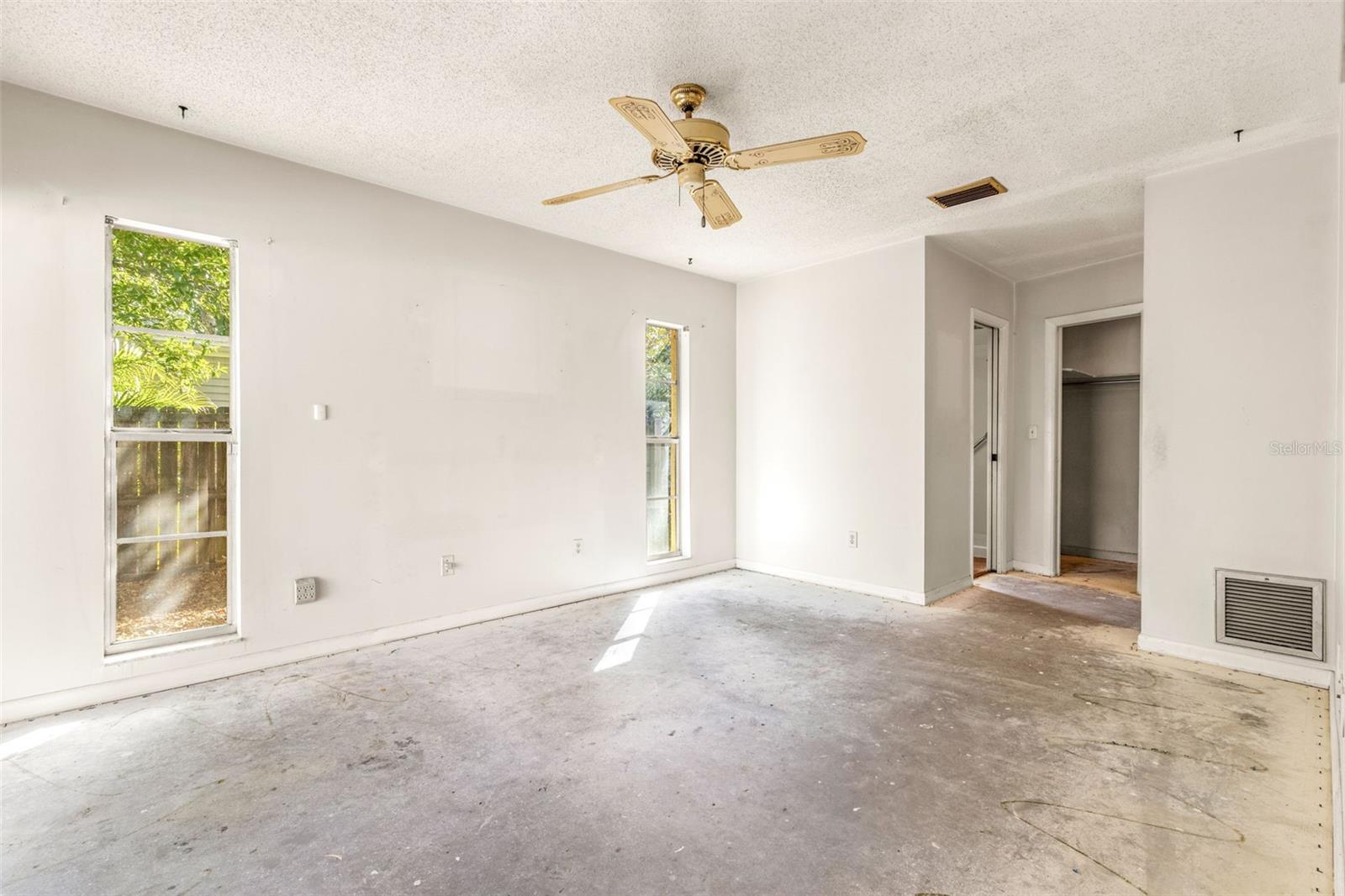 Primary bedroom with walk-in closet