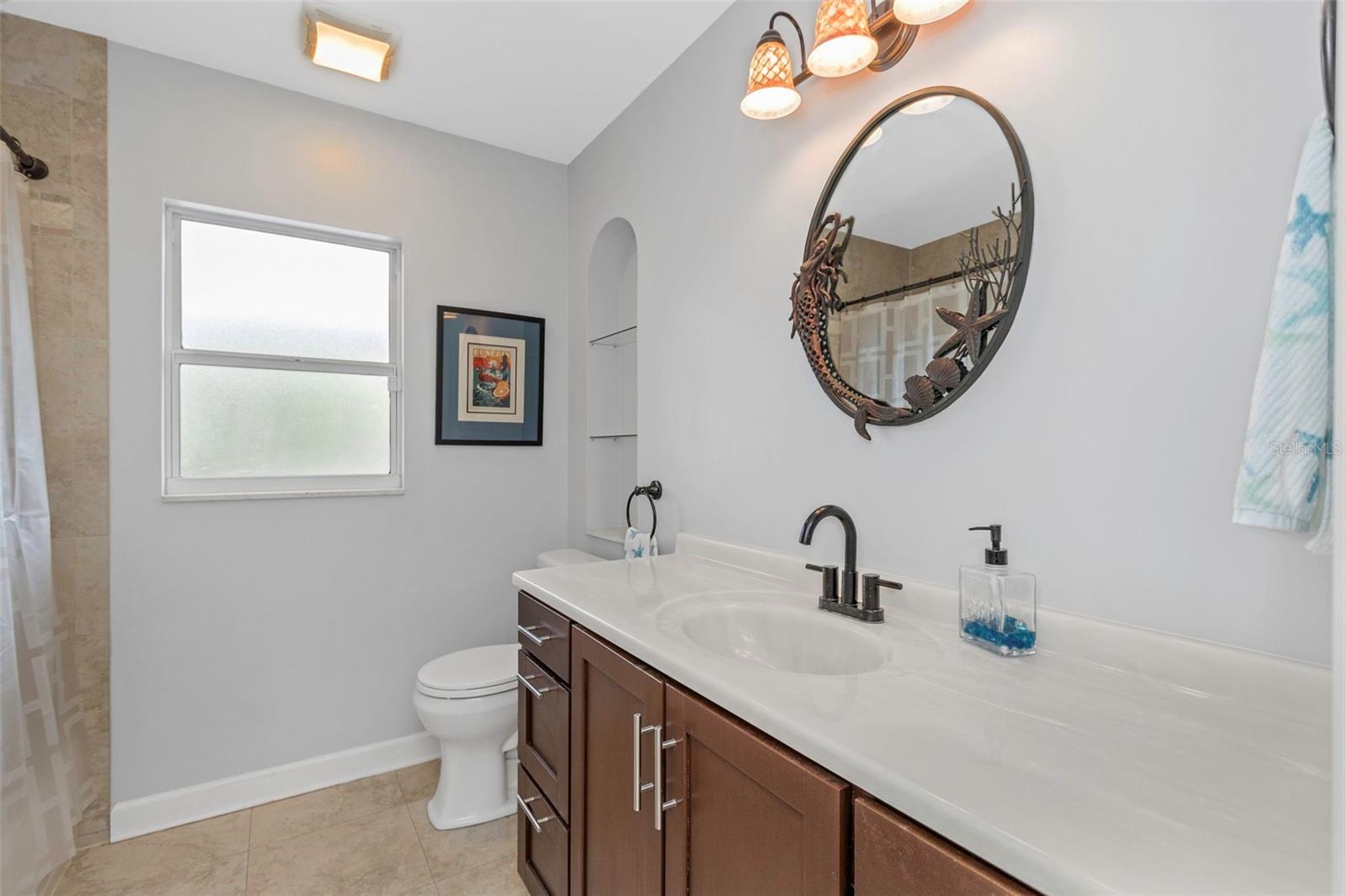 Bathroom with tub / shower combination.