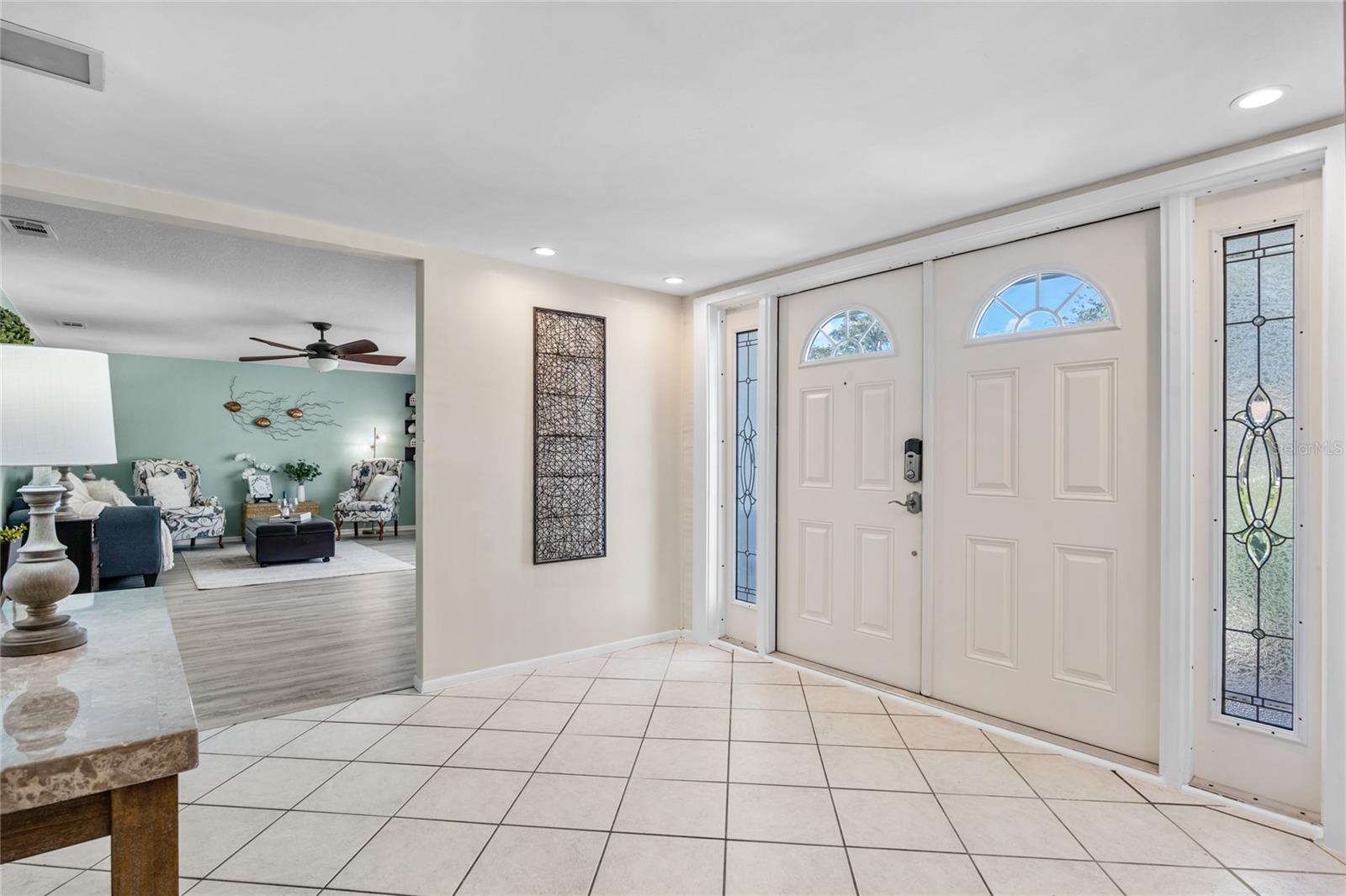 A generously sized Foyer invites you into the home through striking double doors.