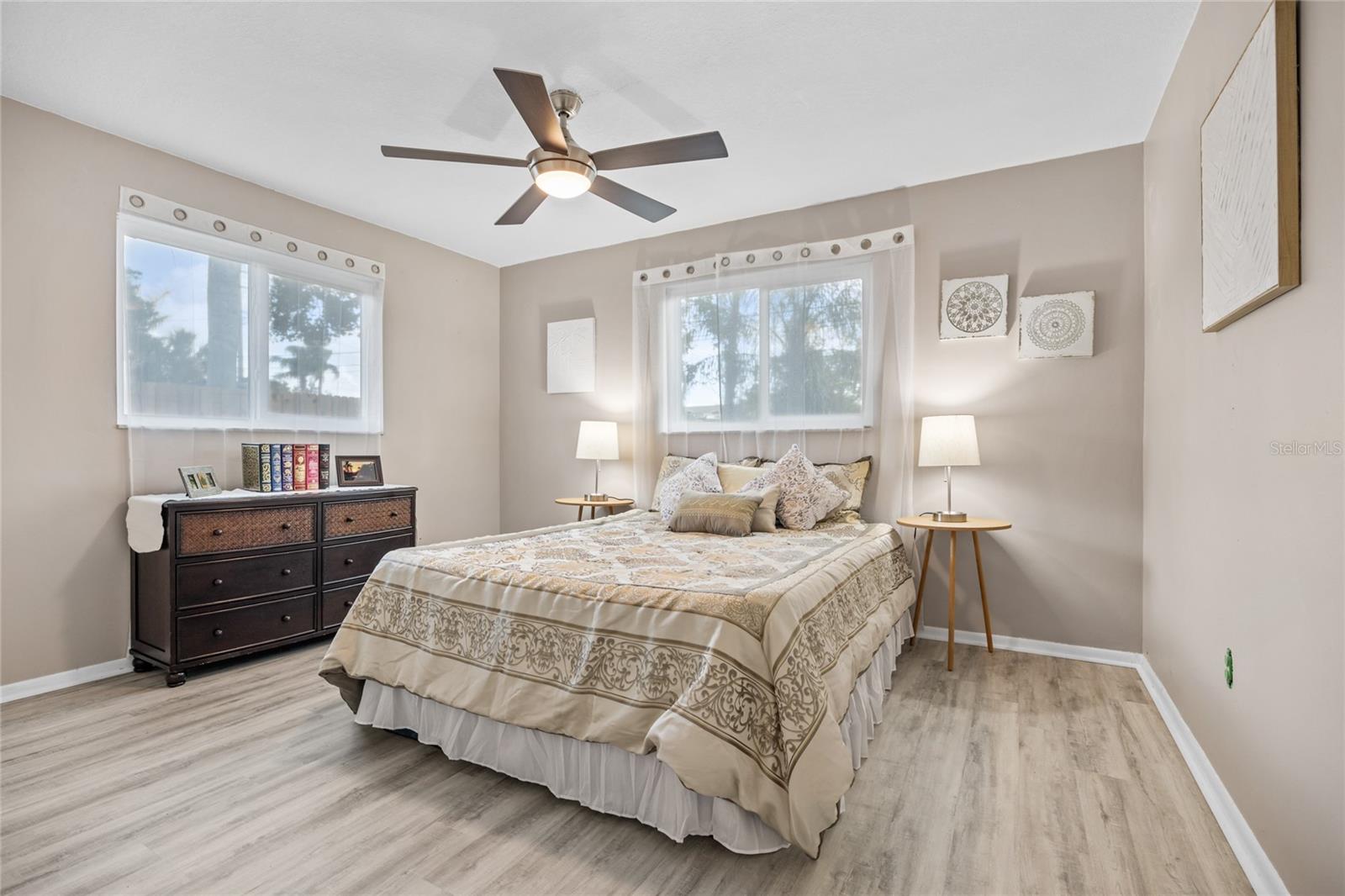 Bedroom #3 has luxury vinyl flooring and two large windows.