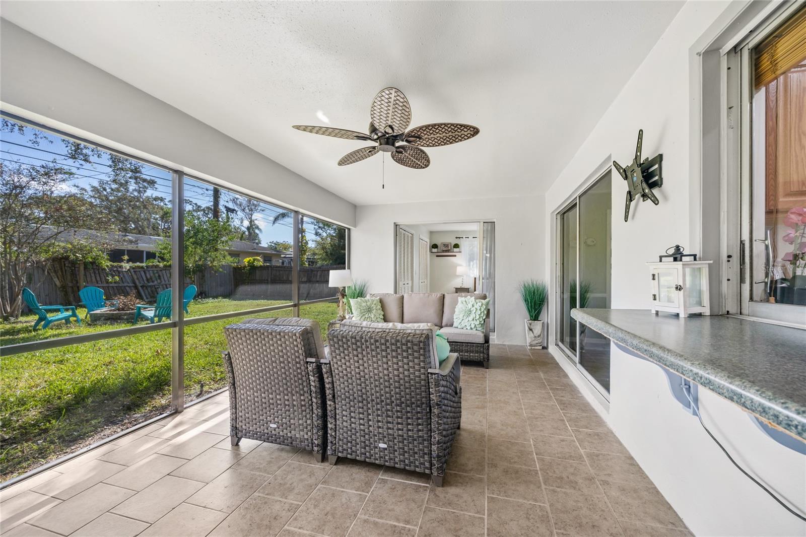 With three separate sets of doors leading to the lanai, this space effortlessly invites you to relax and enjoy the outdoors—it's the perfect spot where you might find yourself spending all your time