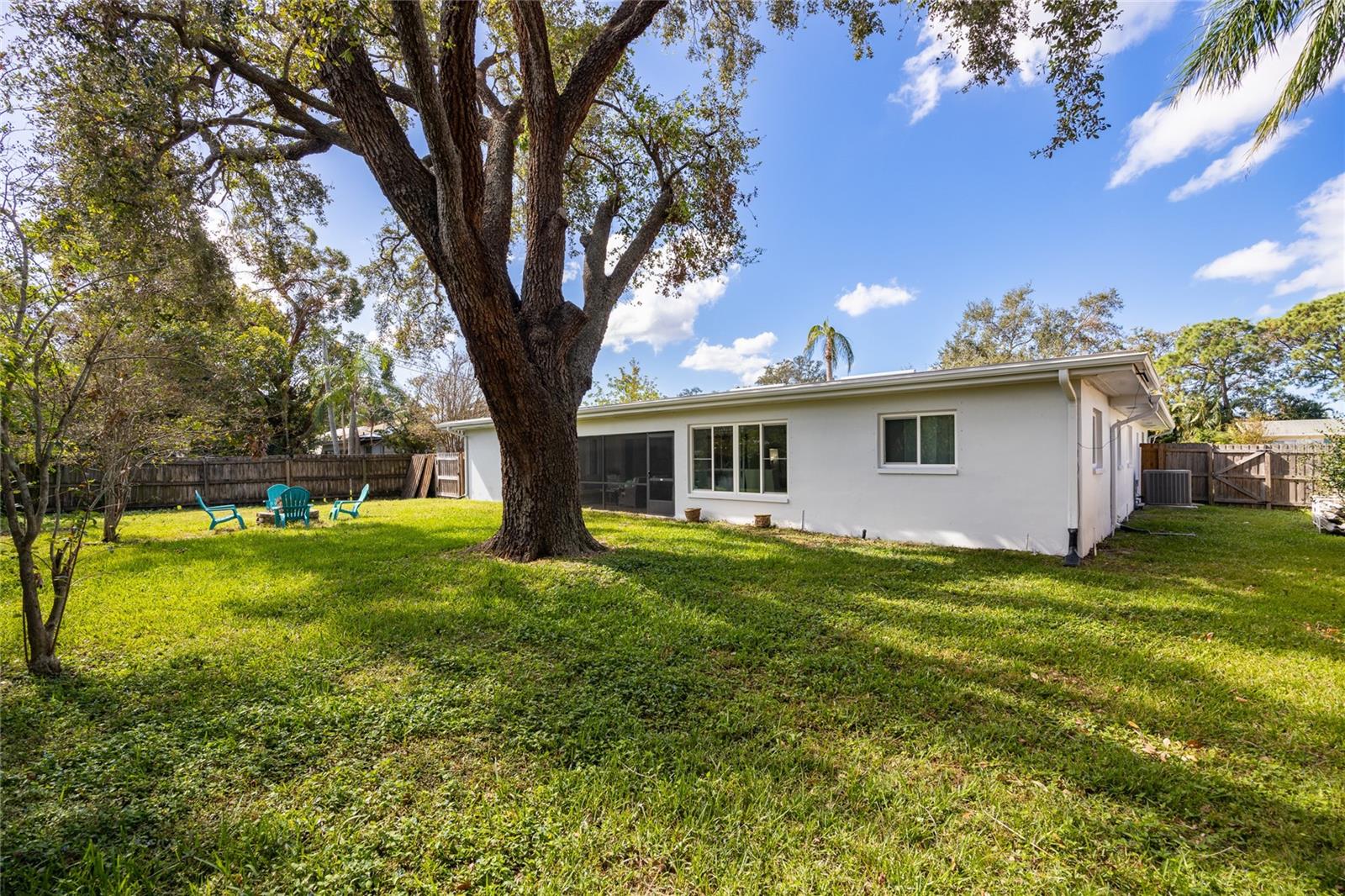 The expansive fenced backyard offers endless possibilities—it features a cozy fire pit and provides plenty of space to add a pool, start a garden, or set up a playset. The options are nearly limitless!